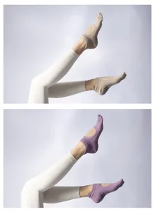 Detailed view of non-slip five-toe yoga socks for women, professional pilates grip footwear.