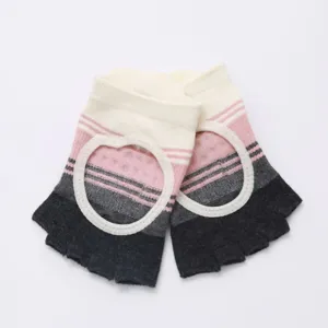 Close-up detail of open-back yoga half-toe socks with color-block stripes for anti-slip grip.