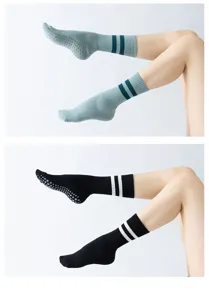 Non-slip grip yoga Pilates socks with cushioned long crew length and double stripes design.