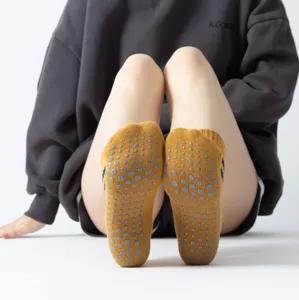 Non-slip yoga pilates socks with grip dots, yellow athletic floor socks for women main view.