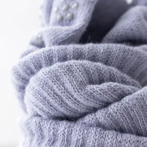 Close-up detailed view of purple knitted yoga socks texture with non-slip silicone grip dots.
