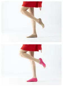 Close-up detail of women non-slip split-toe yoga socks with strap design for fitness.