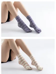 Comfortable striped five-finger yoga socks with cute cat design for pilates and dance.