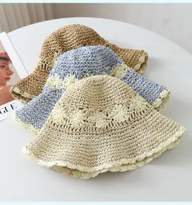 Detailed view of women's summer hollow woven straw fisherman hat, stylish beach sun hat.
