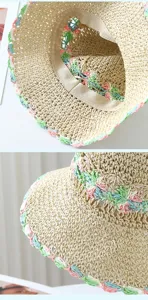 Detailed view of the pastoral style woven straw hat featuring colorful floral crochet brim.
