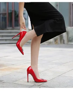 Red pointed-toe stiletto high heels featuring a dazzling crystal square buckle, chic.