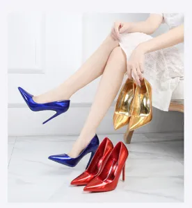 Glossy patent leather pointed stiletto high heels, sexy fashion footwear for women, detail shot.