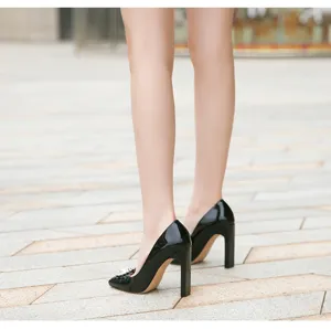 Black patent leather high heels with square toe and sparkling rhinestone buckle for women.