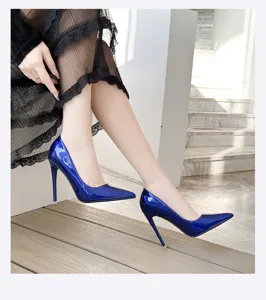Close-up detail of glossy royal blue pointed toe stiletto high heels fashion footwear.