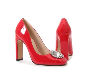 Red patent leather square toe block heels with shimmering rhinestone crystal buckle.