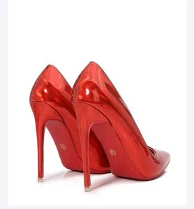 Close-up detail of glossy red stiletto high heels showcasing the pointed toe and heel design.