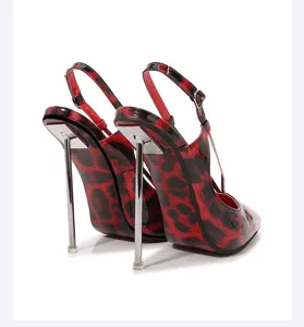 Detailed view of red and black leopard print stiletto high heels with metal heel.
