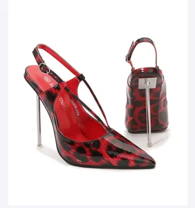 Close-up detail of red black leopard print slingback high heels with metallic stiletto heel.