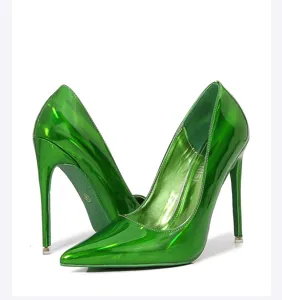 Detail view of glossy green stiletto high heels, pointed toe and slim heel design.