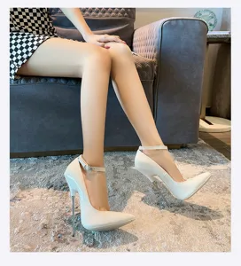 Stunning white patent leather stiletto high heels with 16cm metal heel, elegant ankle strap detail.