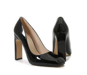 Detailed view of black patent leather square toe block high heels, glossy finish and chunky heel.