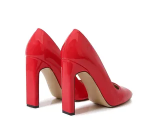 Red patent leather block heel pumps with square toe, stylish high heels for women detail view.