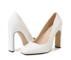 White patent leather square toe chunky high heel pumps detail shot, elegant women dress shoes.