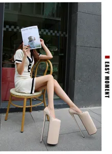 Detailed view of extreme platform high heels in nude patent leather with ultra high stiletto heel.