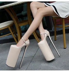Glossy platform high heels with extreme stiletto heel and ankle strap for party or dance.