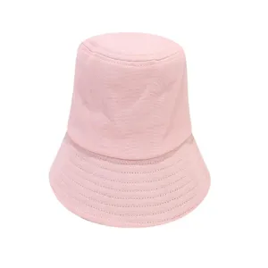 Pink cotton bucket hat detail view, stylish casual outdoor sun protection plain hat.