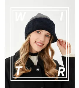 Close-up detail of the cozy winter knit hat featuring a stylish two-tone folded brim design.