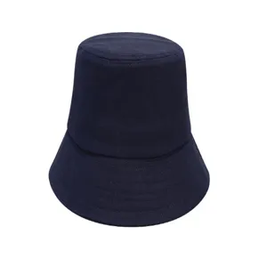 Detailed close-up shot of the dark blue cotton bucket hat, showing fabric texture.