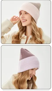 Detailed closeup view of a stylish two tone knit beanie showing soft winter texture and warm fit.