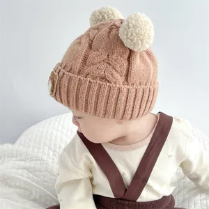 Cute baby knit beanie with double pom poms and bear patch, cozy autumn winter infant hat.