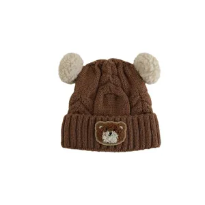 Cute baby knitted winter hat with cute bear patch and two pom poms for toddlers warm