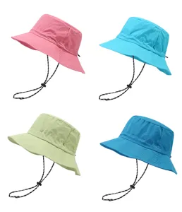 Detailed view showing multi-color quick-dry bucket hats with adjustable chin straps for outdoor sun.