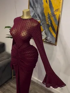 Women's burgundy sheer mesh polka dot long sleeve pleated maxi dress for elegant evening wear.
