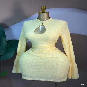 Detailed close-up view of the yellow long sleeve cut out jacquard sweet sexy mini dress.