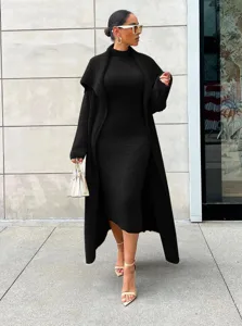 Detailed view of the elegant black autumn winter long cardigan and dress two piece set fashion outfit.