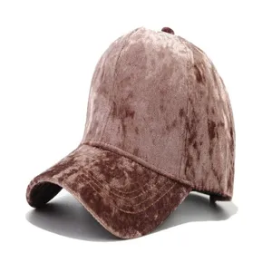 Velvet baseball cap detail showing soft gold texture, curved brim, and neat stitching for winter.