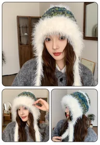 Primer plano detallado del gorro estilo ruso de piel sintética con cómodas tiras trenzadas.