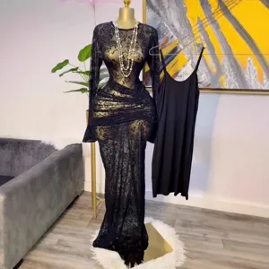 Detail view of the black sheer mesh floral flocked long sleeve maxi dress with inner slip.