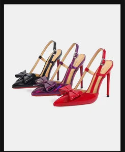 Glossy patent leather pointed toe slingback high heels with elegant bow and chic red soles.