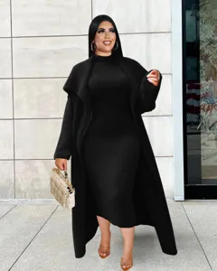 Detailed view of women elegant black two-piece dress and long cardigan set for autumn winter.