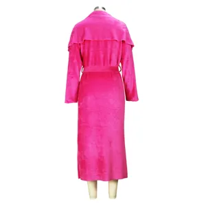 Detailed rear view of a bright pink plush long cardigan coat with a belt and shawl collar.