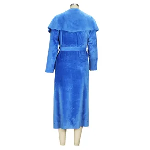 Back view detail of the royal blue plush long coat featuring soft fabric and waist belt.
