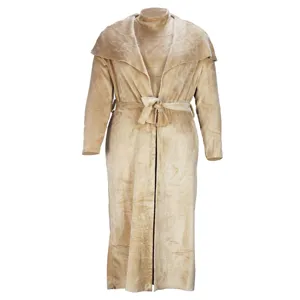 Detail shot of beige plush long cardigan coat and dress set, soft winter fabric texture.