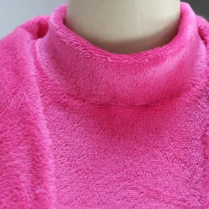 Pink fleece high collar top detail view, soft plush texture fabric for winter warmth apparel.