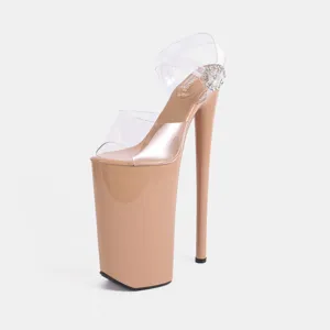 Close-up detail of clear strap and crystal buckle on high platform high heel sandals.