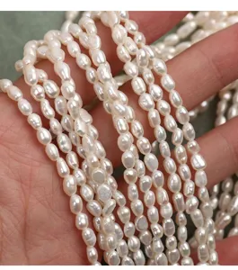 Detail view of natural freshwater baroque pearl strands, loose beads for DIY jewelry making.