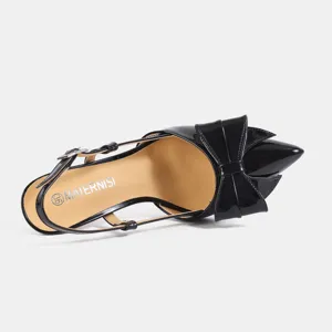 Black patent leather slingback high heel shoes with elegant bow and pointed toe design.