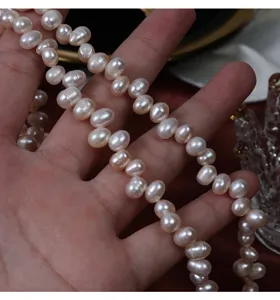 Close-up detail of natural pinkish freshwater pearls, perfect for DIY jewelry crafting project.