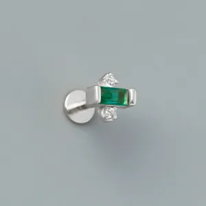 Macro detail of S925 sterling silver labret earring with green and white zircons