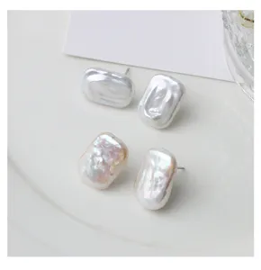 Natural freshwater pearl stud earrings with irregular rectangular shape and sterling silver pins.