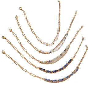 Gold-plated stainless steel layered paperclip chain bracelets with natural stone beads.